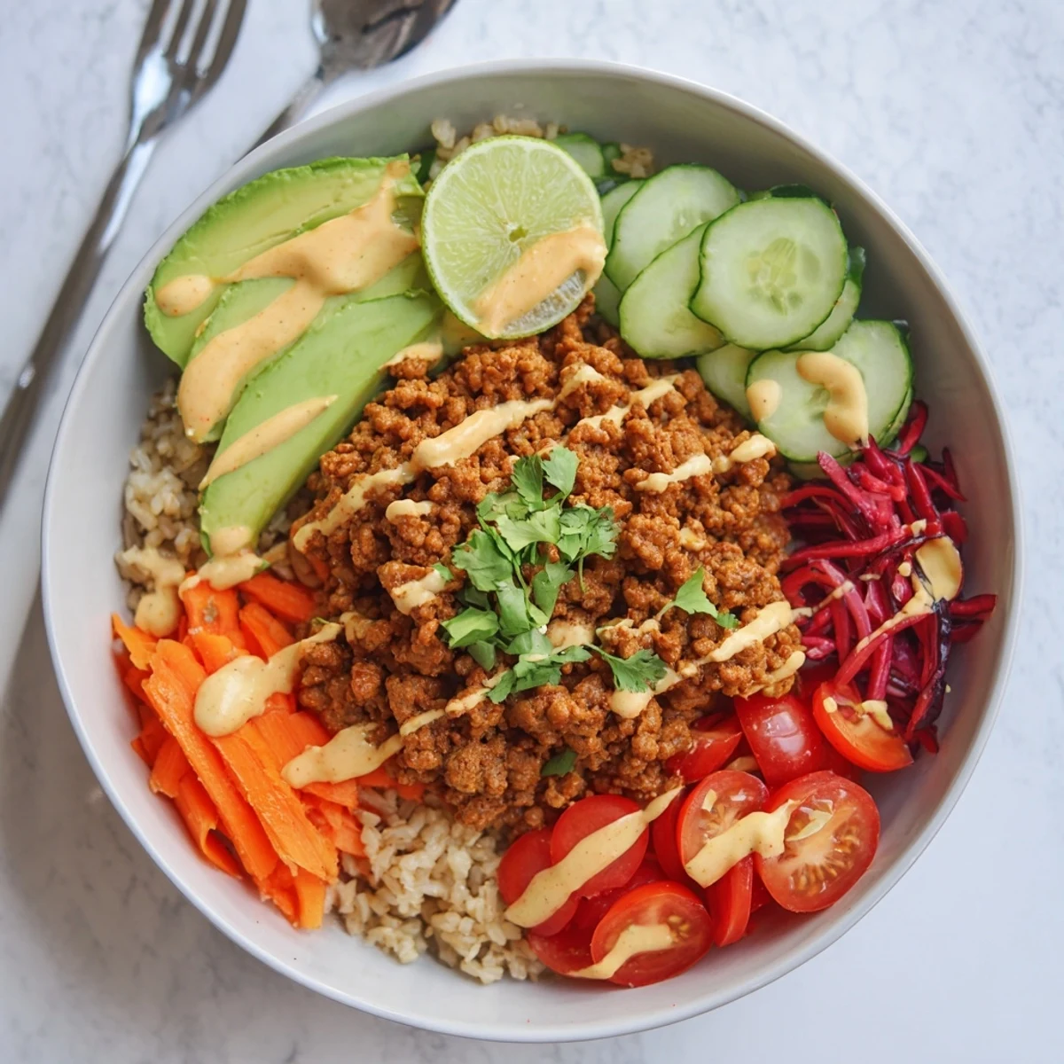 Wholesome Plant-Based Meat Bowl topped with creamy avocado and vibrant red cabbage.  