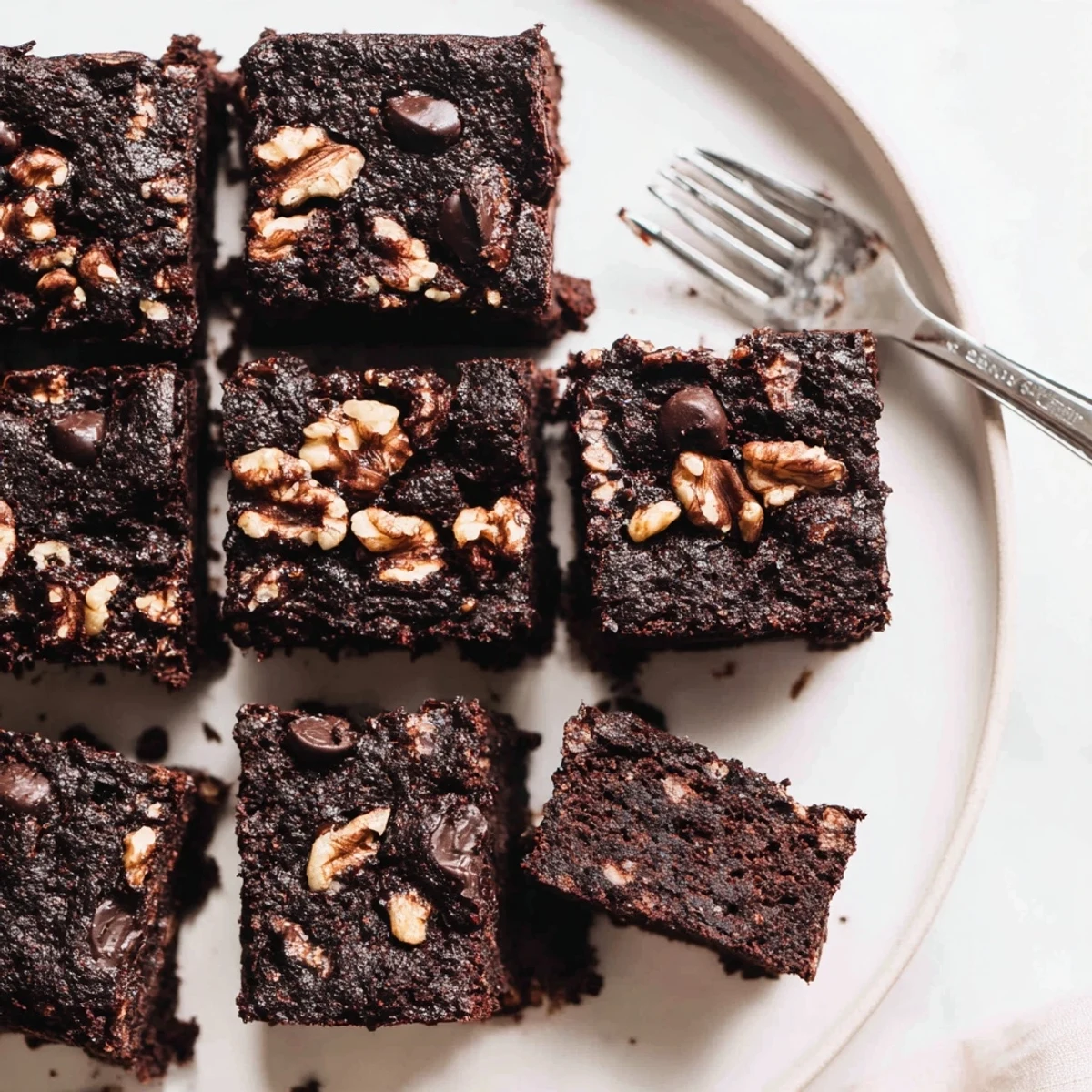 Rich, fudgy zero-waste brownies using nut-milk pulp and dark chocolate chips.