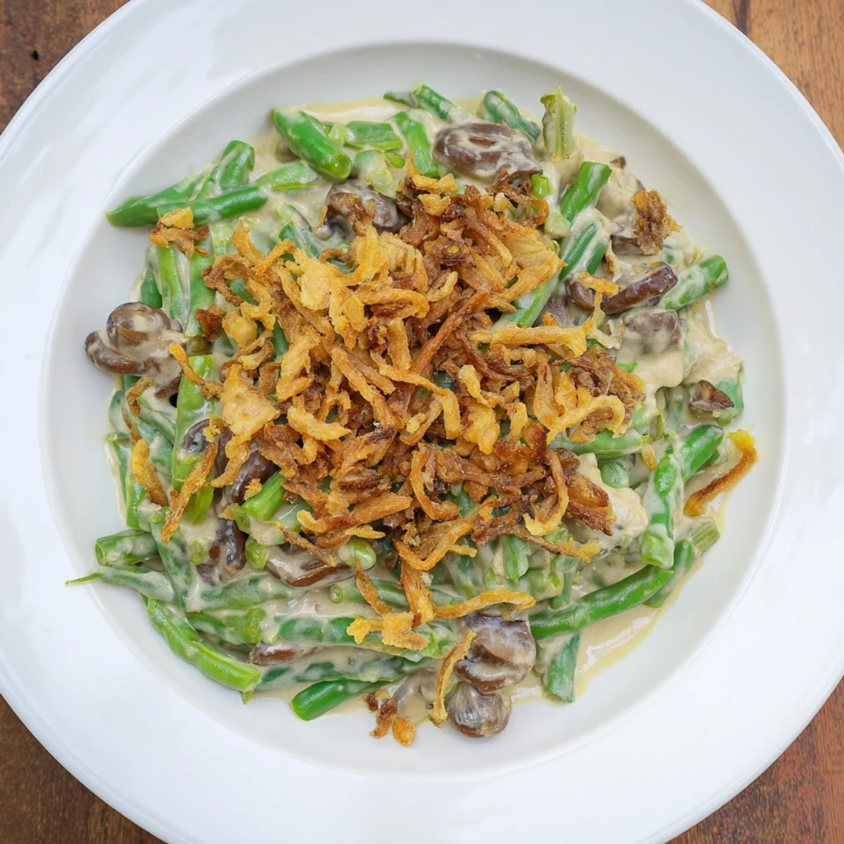 A comforting photo of creamy Old-School Green Bean Casserole, showcasing tender green beans in a rich mushroom sauce.