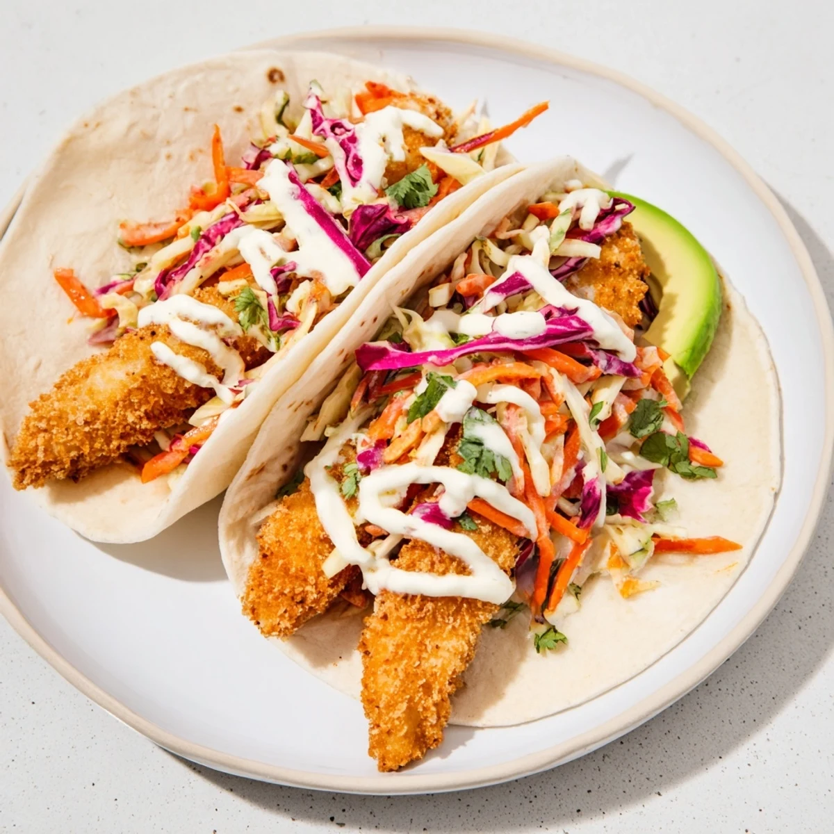 A close-up of beautifully plated crispy fish tacos, perfect for a satisfying meal.