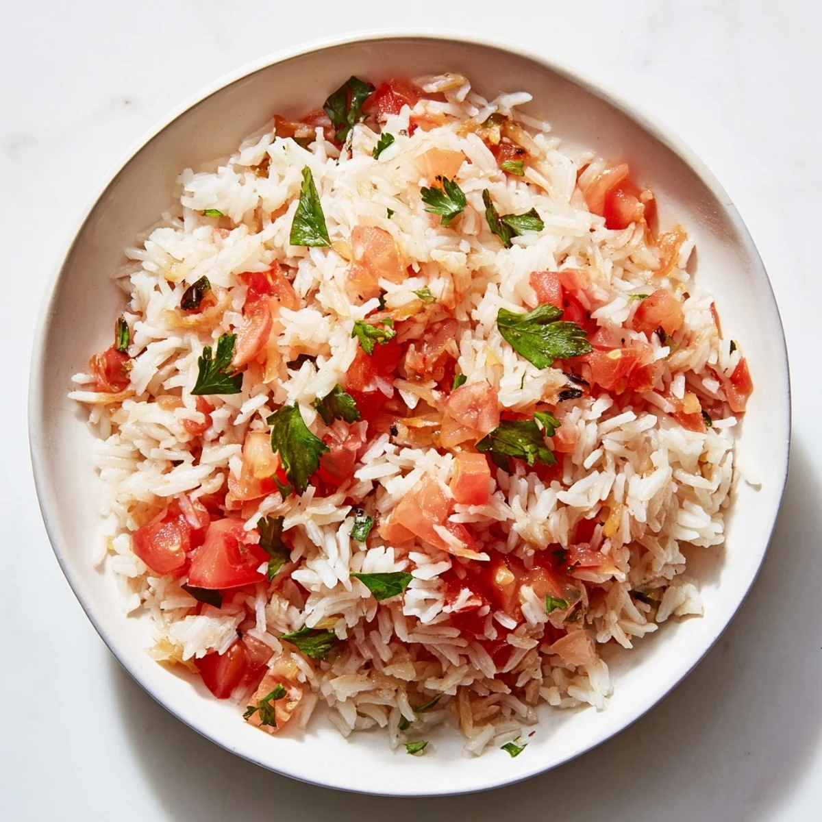 A close-up of a delightful Tomato-Rice Skillet Dinner, featuring fluffy rice and bright red tomatoes.
