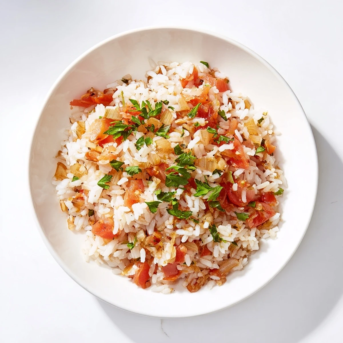 Steaming hot Tomato-Rice Skillet Dinner, with fragrant garlic and herbs, ready to be served.