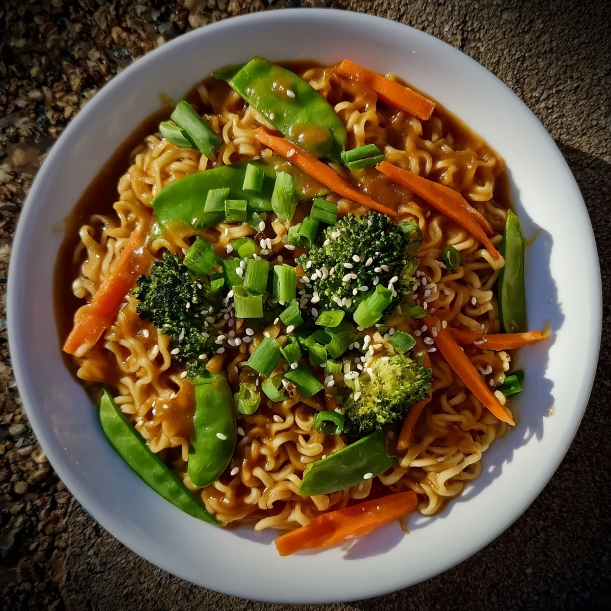 Steaming hot Ramen Noodle Stir-Fry Remix with colorful vegetables and savory sauce, ready to serve.