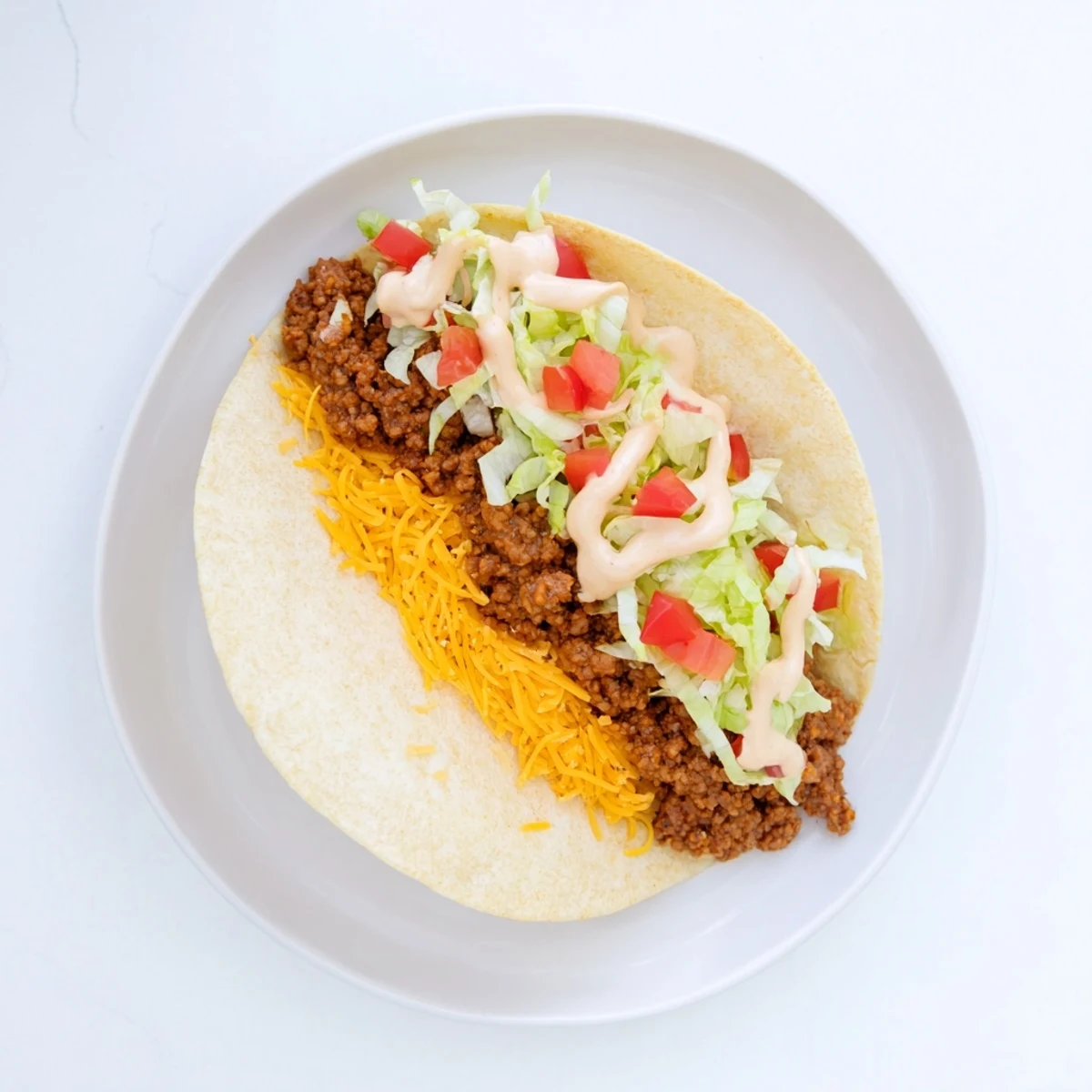 Cheesy Gordita Crunch Tacos with melted cheese, seasoned beef, and crunchy shells, ready to enjoy.