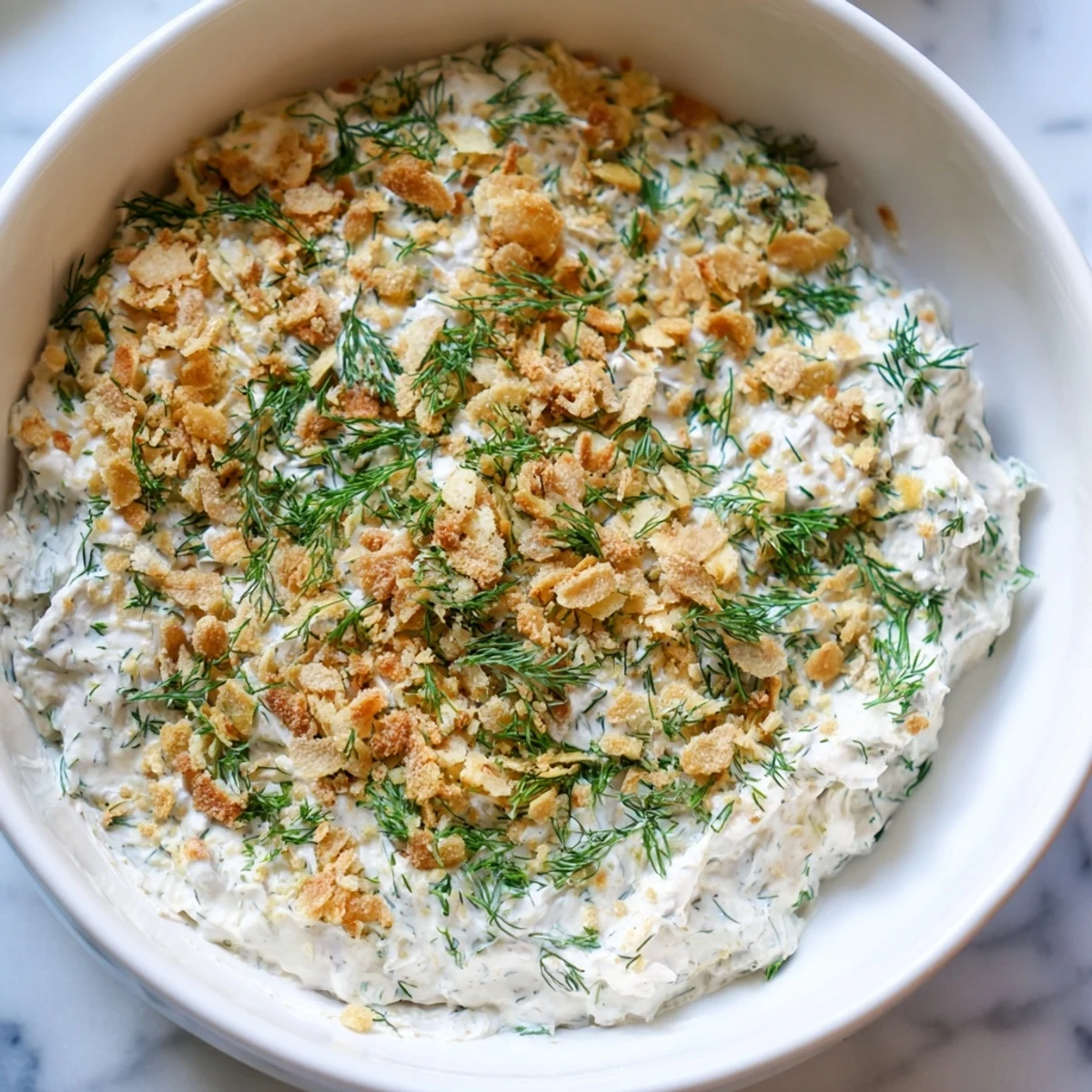 A close-up view of fresh and flavorful Fried Pickle Dip, ready to be scooped up.