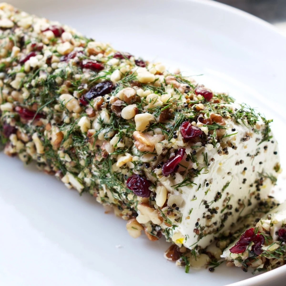 Enjoy the delicious blend of flavors in this easy-to-make Winter Snowdrift Goat Cheese Log.