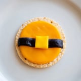 Imagine the colorful Santa's Belt Crackers on a platter, ready to be enjoyed with a vibrant red pepper dip.