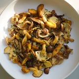 A vibrant close-up of Enchanted Forest Mushrooms, showcasing tender mushrooms garnished with herbs and zest.