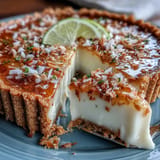 A bright Coconut Lime Tart with creamy filling, topped with toasted coconut.