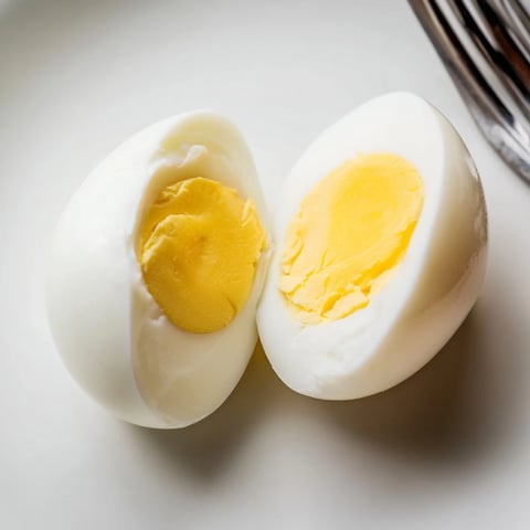 Fluffy air fryer boiled eggs: perfect for breakfast, showing golden yolks and smooth whites.