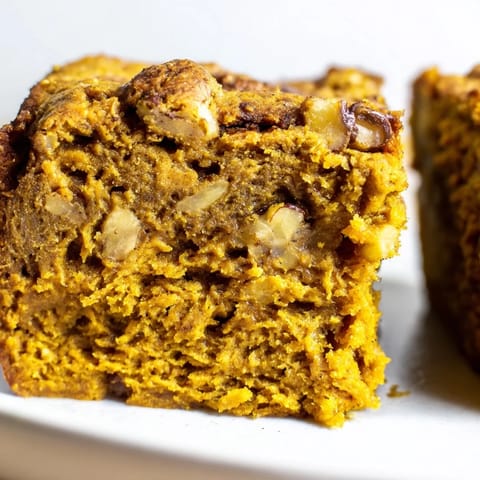 Delicious pumpkin muffin banana bread bars drizzled with cream cheese glaze.  