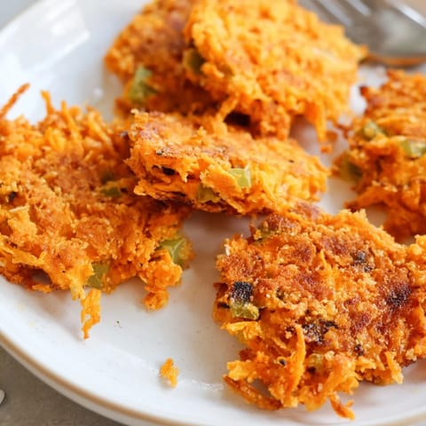 Deliciously crispy Buffalo Chicken Pickle Soda Fork Cakes garnished with fresh scallions.  