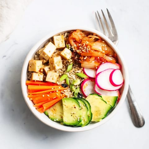 Nourishing fermented vegetable bowl topped with kimchi, avocado, and bright veggies.  
