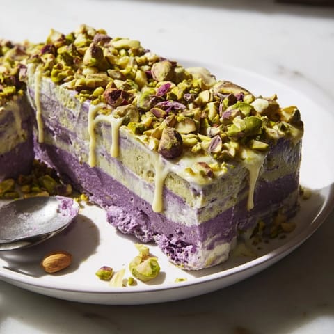 Deliciously layered ube and pistachio ice cream bars, ideal for gatherings.  