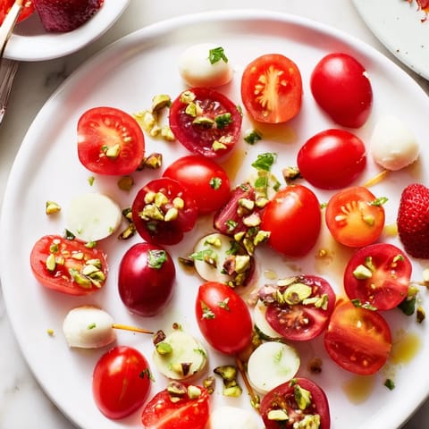 A gorgeous display of the Hanging Gardens appetizer: fruits, goat cheese and pesto ready to enjoy.