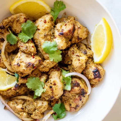 Flavorful Indian Tikka Spiced Chicken, perfectly roasted and ready to serve with fragrant spices and yogurt.