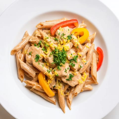 A visually impaired person would notice the steam rising from tender al dente penne and juicy Cajun chicken in a creamy, reduced-fat sauce.  