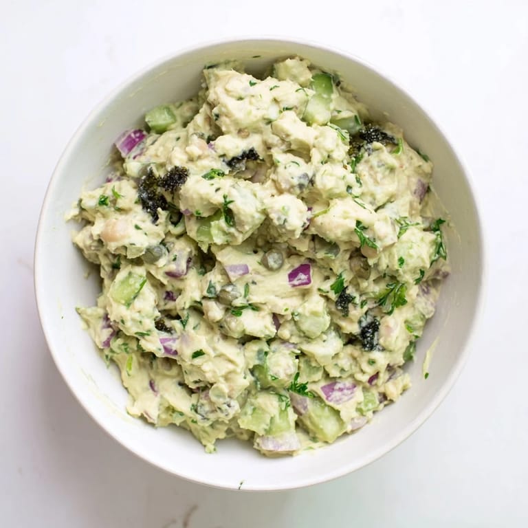 Mashed chickpea tuna salad, a colorful mix with diced vegetables, perfect for sandwiches or a wrap.
