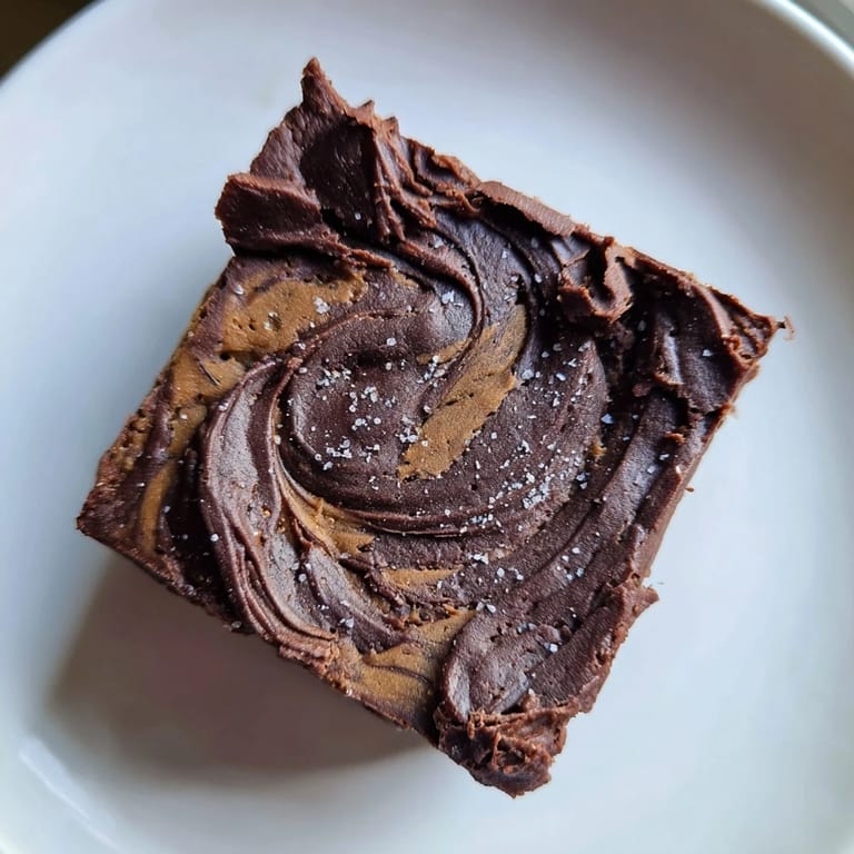 Warm, rich Pumpkin Workout Brownies ready to be sliced, inviting you to enjoy a guilt-free dessert.