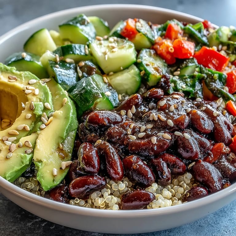 Close-up view of the Three-Bean Power Bowl, showcasing a colorful mix of quinoa, beans, and crunchy vegetables.