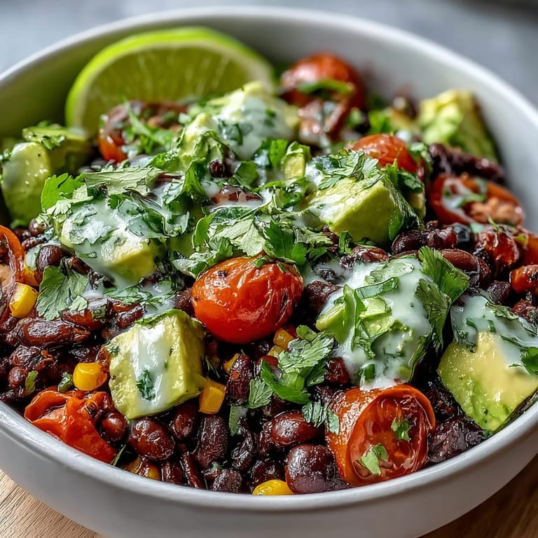Healthy Black Bean and Veggie Bowl garnished with cilantro and pumpkin seeds for a satisfying meal.
